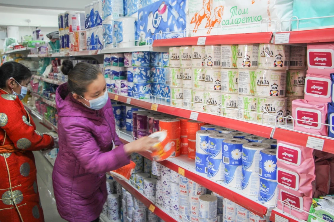 E-Voucher beneficiary shops for household essentials in local supermarket in Dundgovi aimag